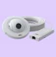 White camera with round shape and cables leading to a small box.