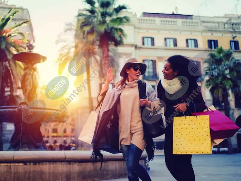 2women_shopping_outdoors_fountain_2011_hi_2600x2950px.jpg.jpg
