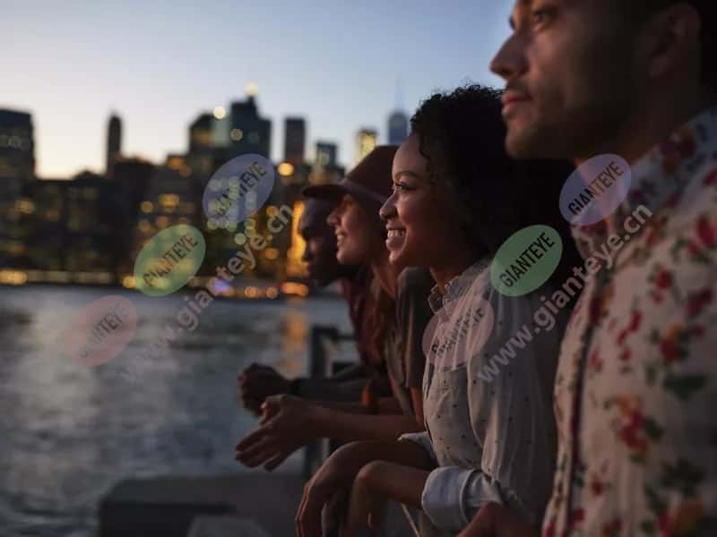 group_young_people_looking_over_water_city_evening_2005_2600x1950.jpg.jpg