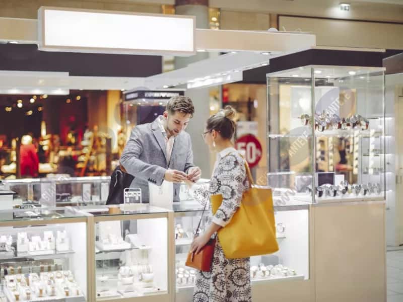 man_helping_woman_customer_jewelry_shopping_2109_2600x1950.jpg.jpg